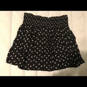 Large black skirt with white floral print.